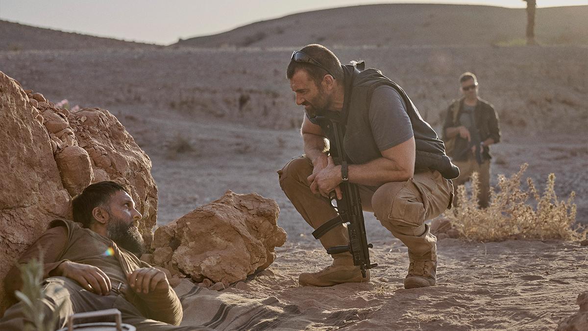 Shazad Latif on set in the desert.