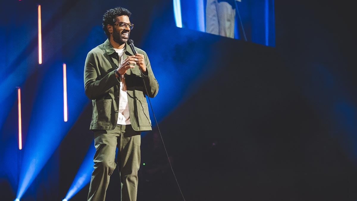 Romesh Ranganathan on stage.