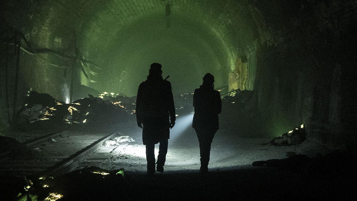 Daryl and Carol escape to England through the English tunnel.