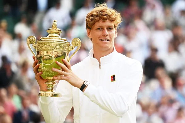 Wimbledon 2025 men’s singles champion Jannik Sinner raises the trophy. Watch Wimbledon 2026 on Virgin TV.