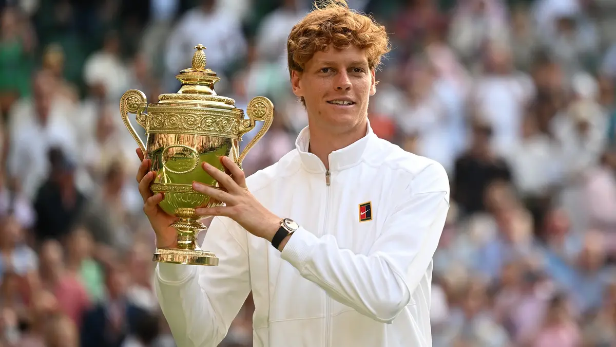 Wimbledon 2025 men’s singles champion Jannik Sinner raises the trophy. Watch Wimbledon 2026 on Virgin TV.