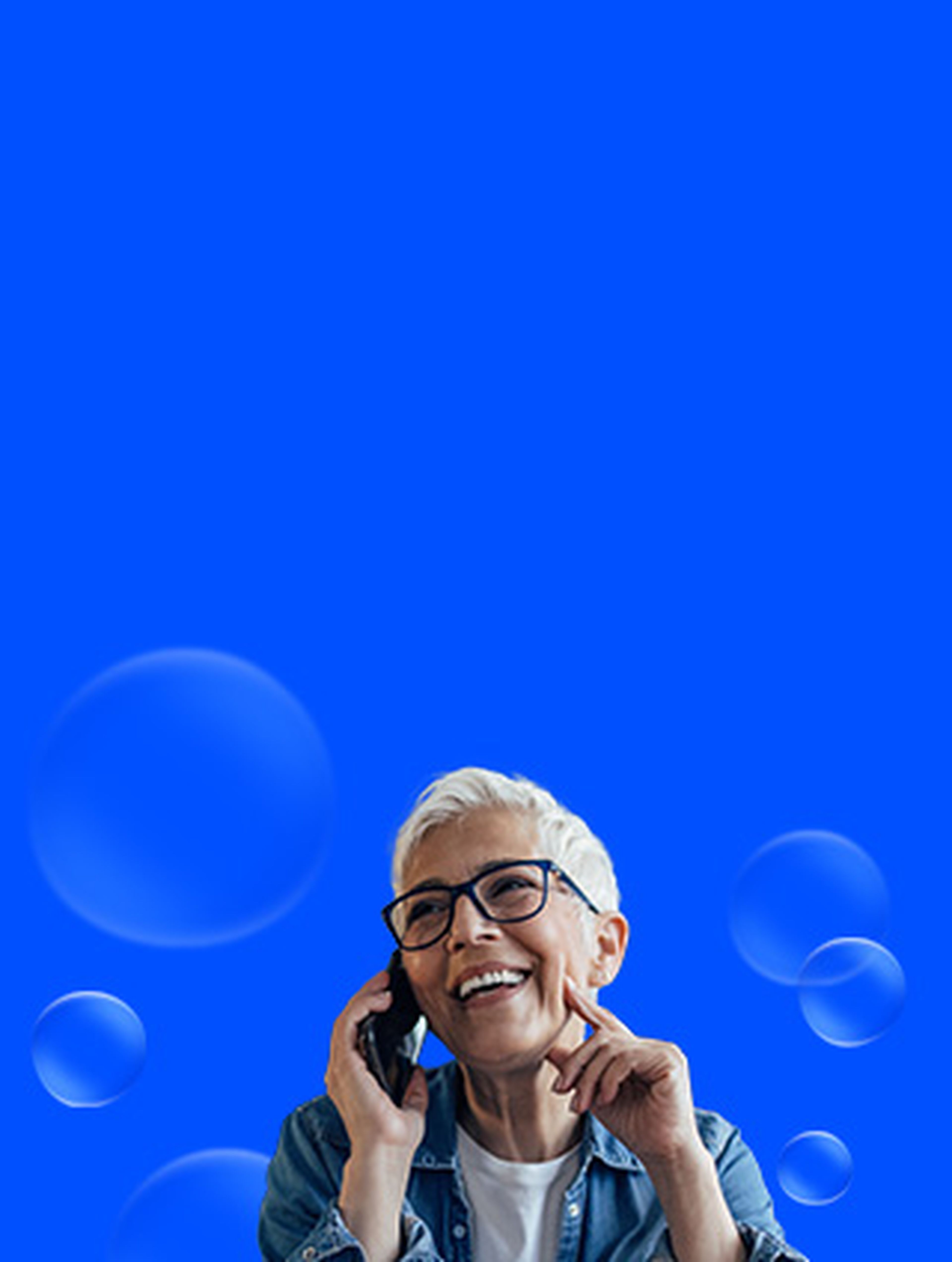 Woman laughing and talking on a mobile phone