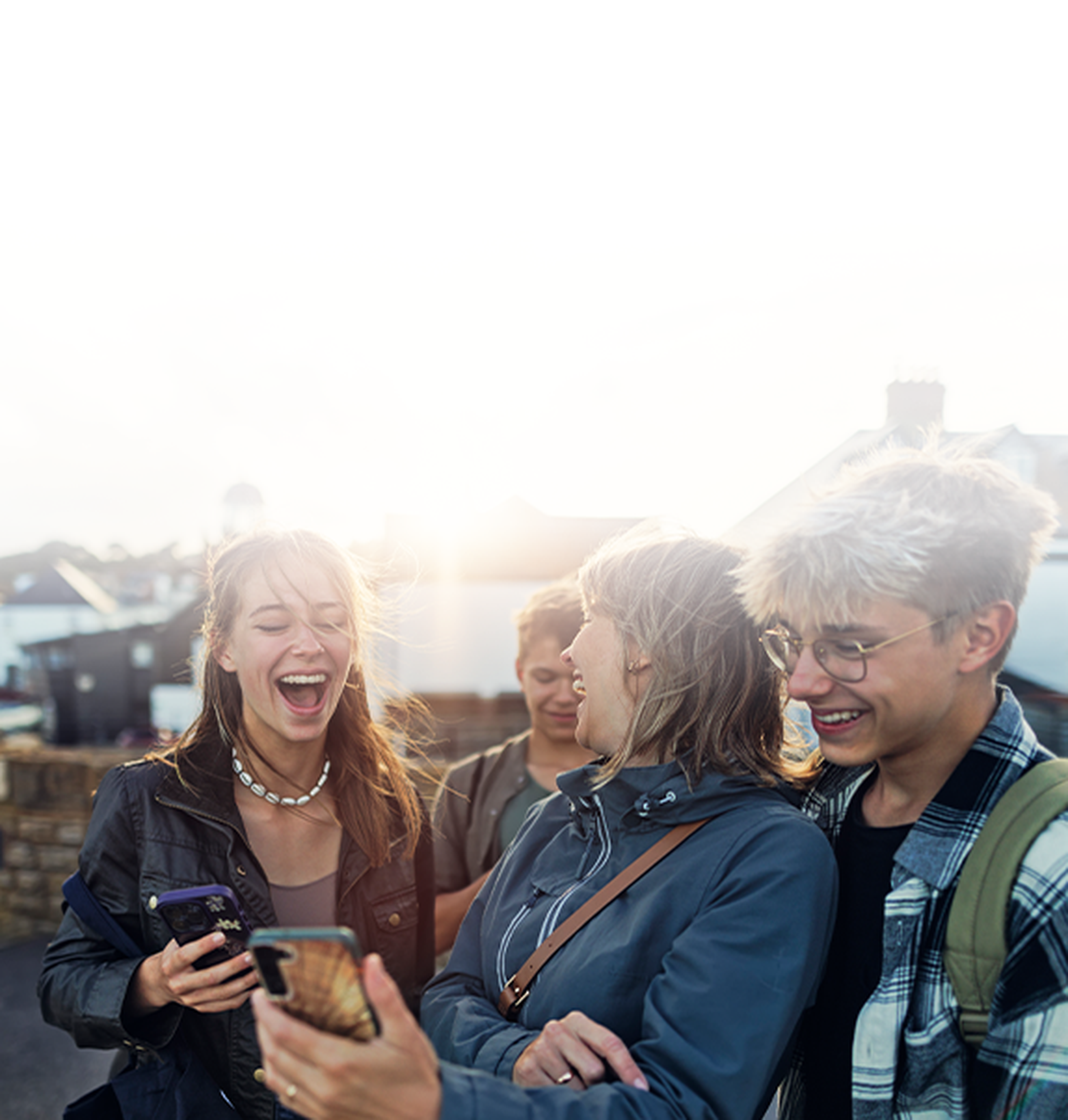 Family laughing looking at the phone
