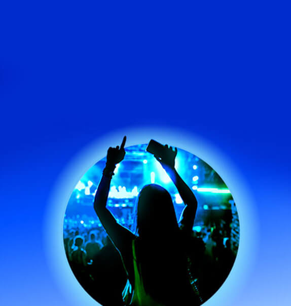 Woman with hands up at O2 concert