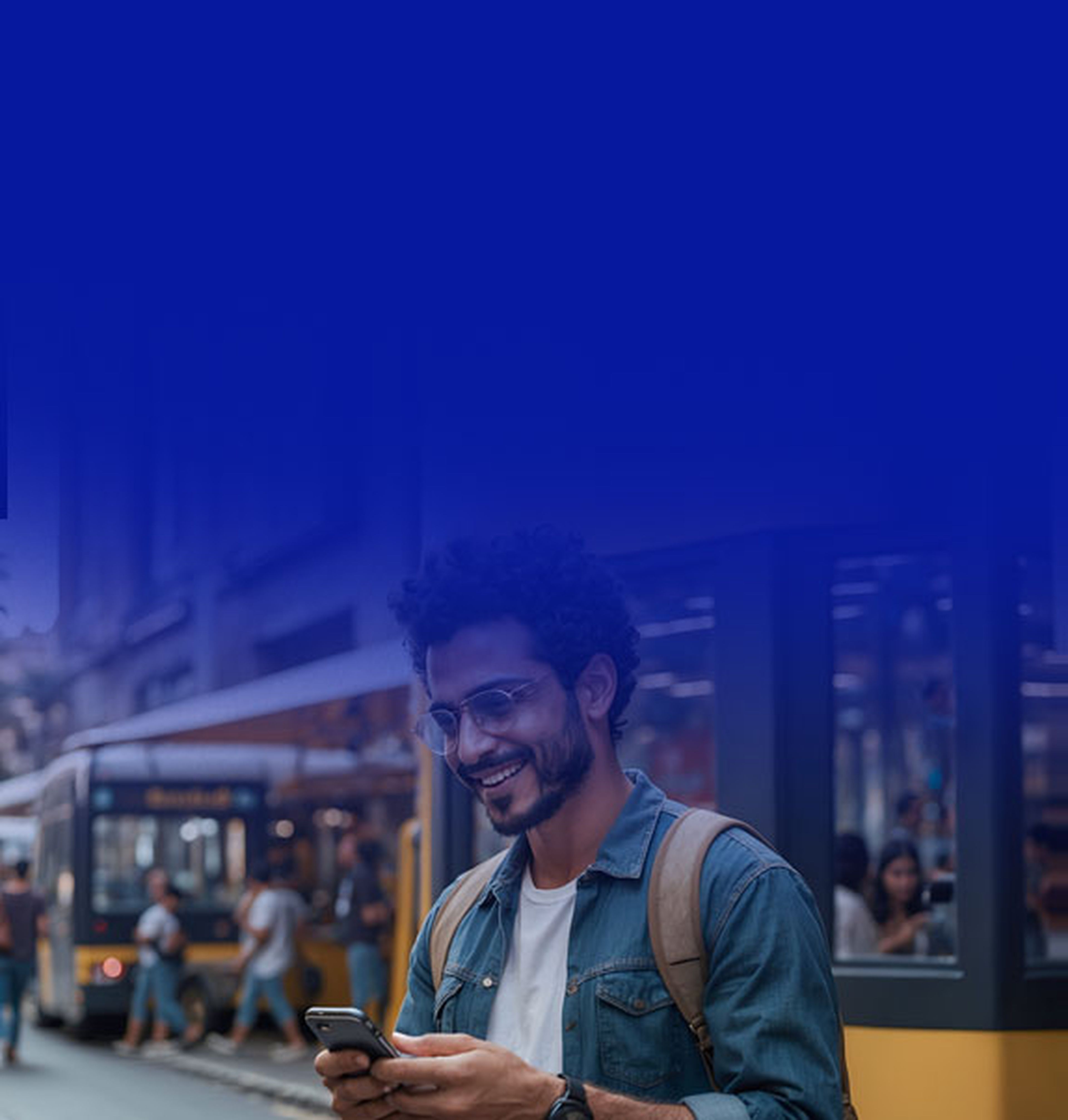 Man smiling and looking at phone