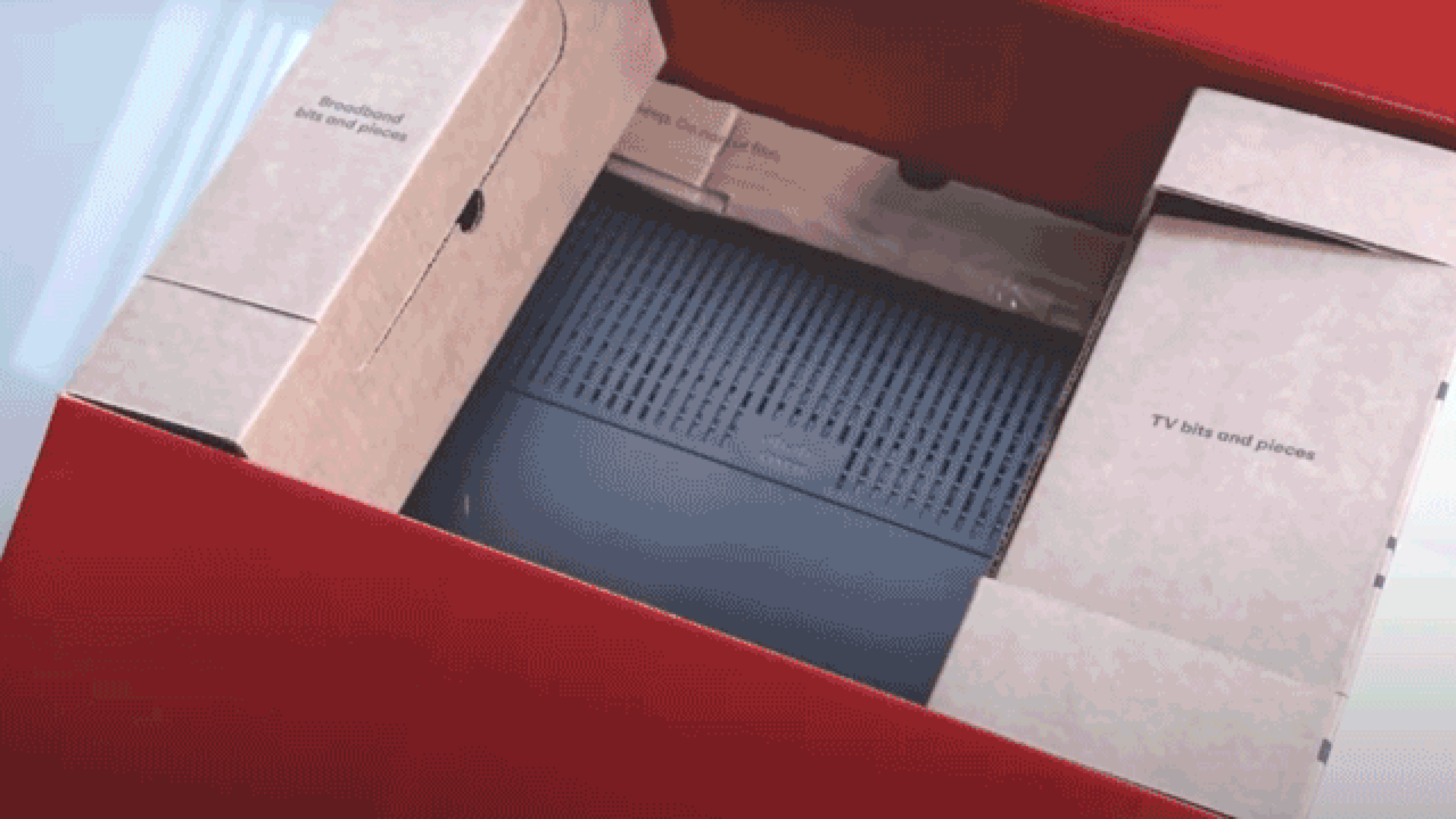 Virgin Media router being packed into a box. Collectplus.co.uk is then used to send the package.