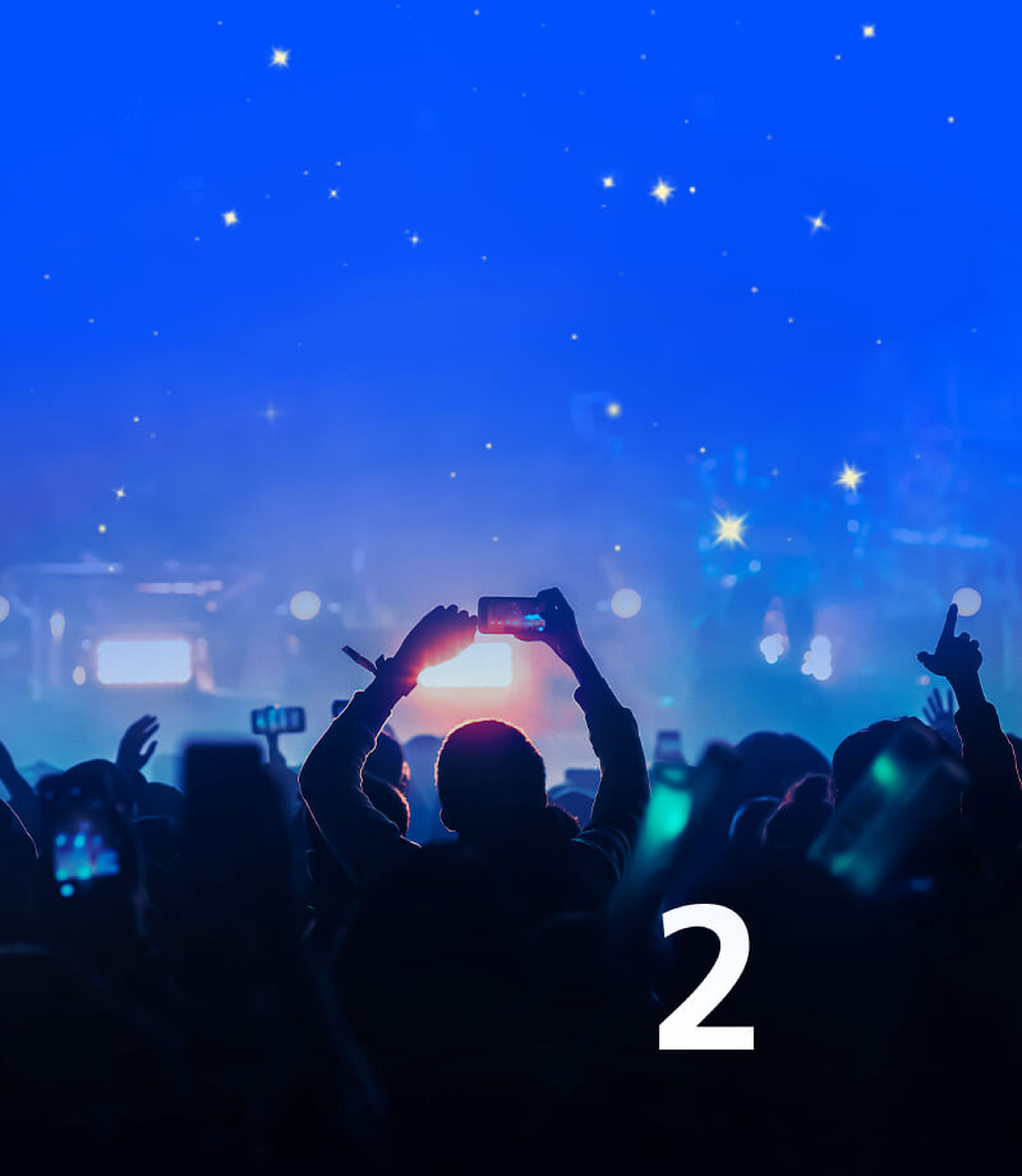 Man with hands up at O2 concert