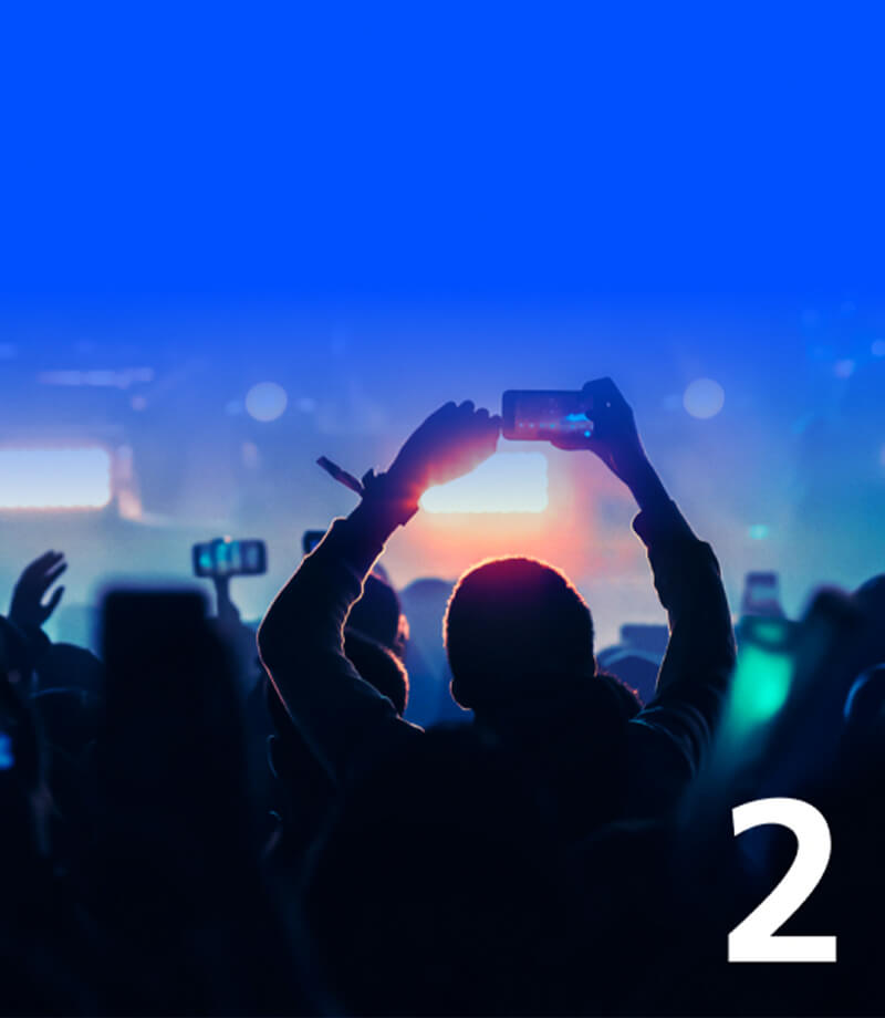 Man with hands up at O2 concert