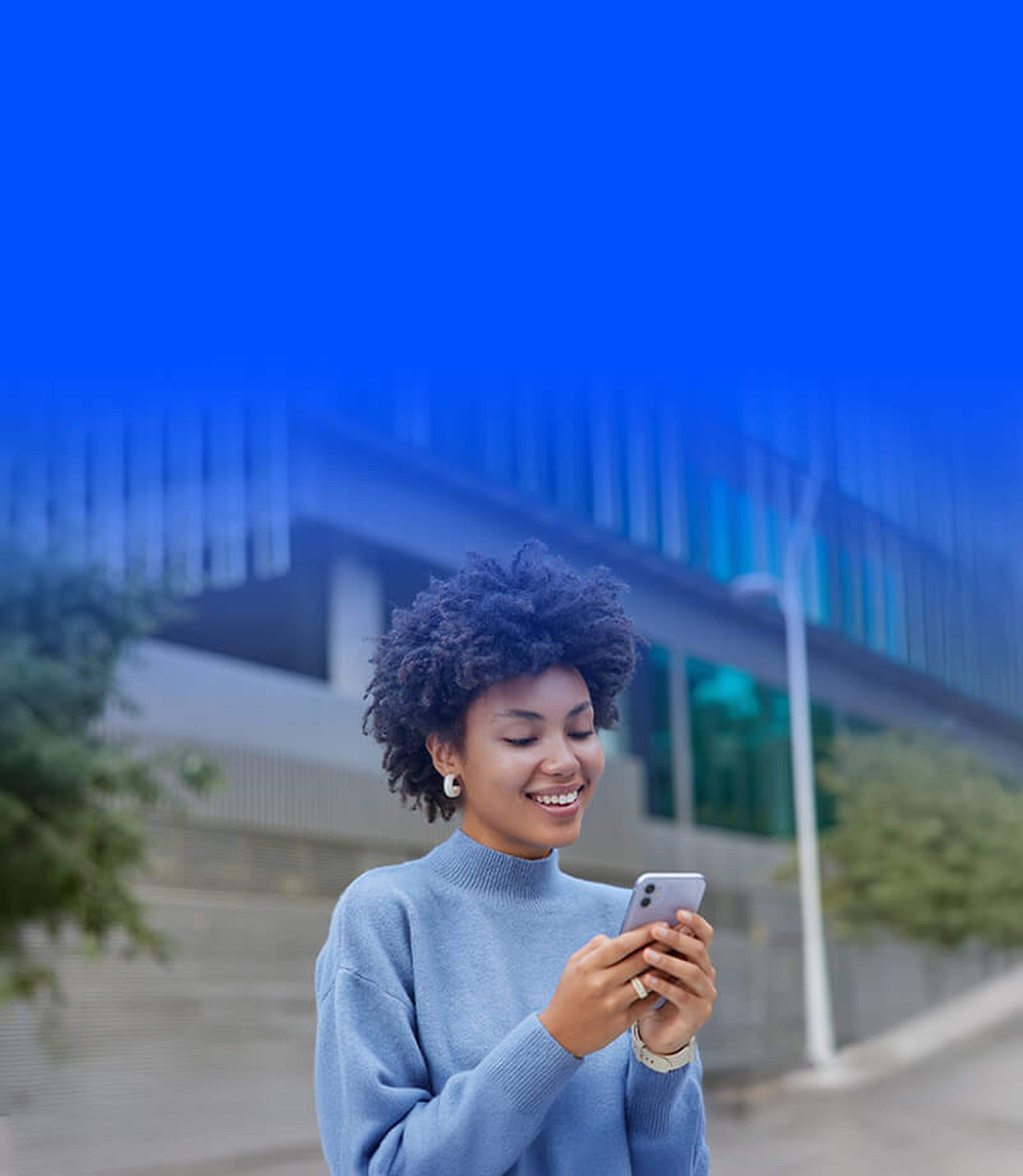 Lady with phone in hand smiling   