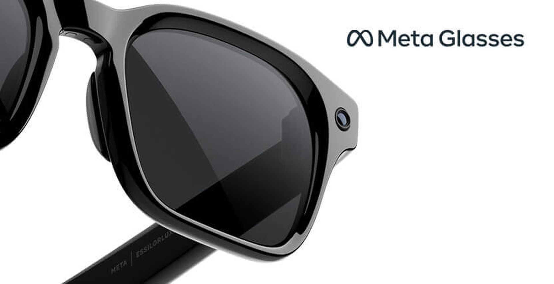 Black high-tech glasses with sleek frames and dark lenses, featuring a small integrated camera on the corner. Branding text "Meta Glasses" is visible.