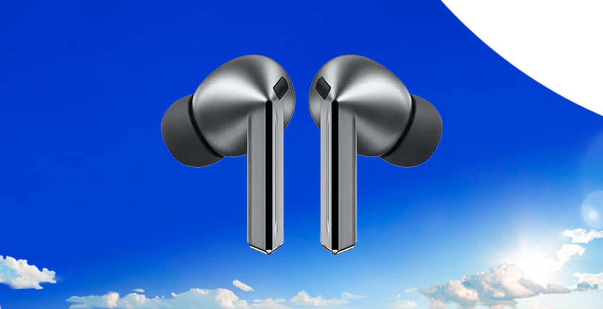 Galaxy Buds 3 PRO against a bright blue sky with clouds and a hint of sunlight at the bottom.