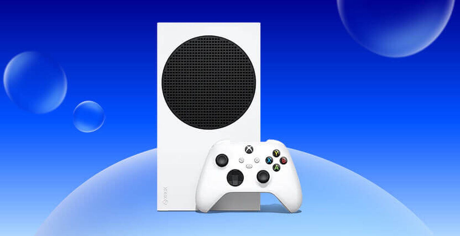 A white gaming console with a black circular vent and a matching controller, set against a blue background with bubbles.