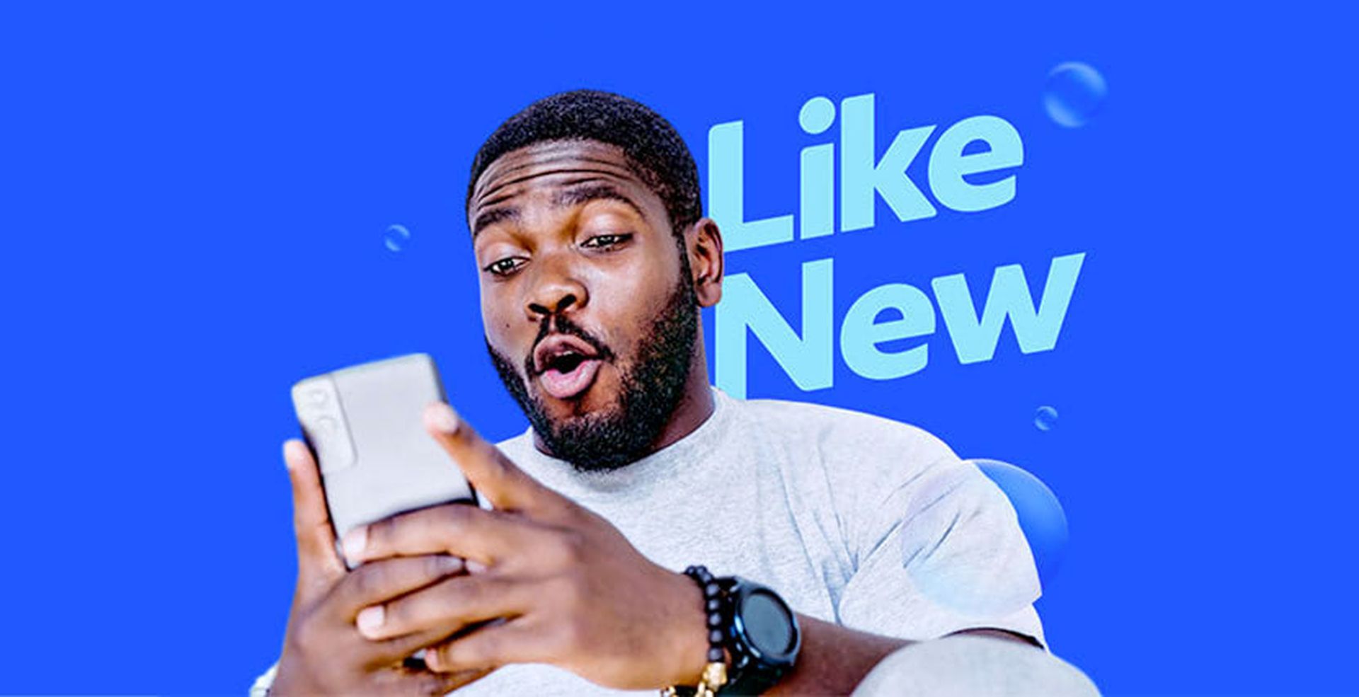 Black male looking at mobile phone