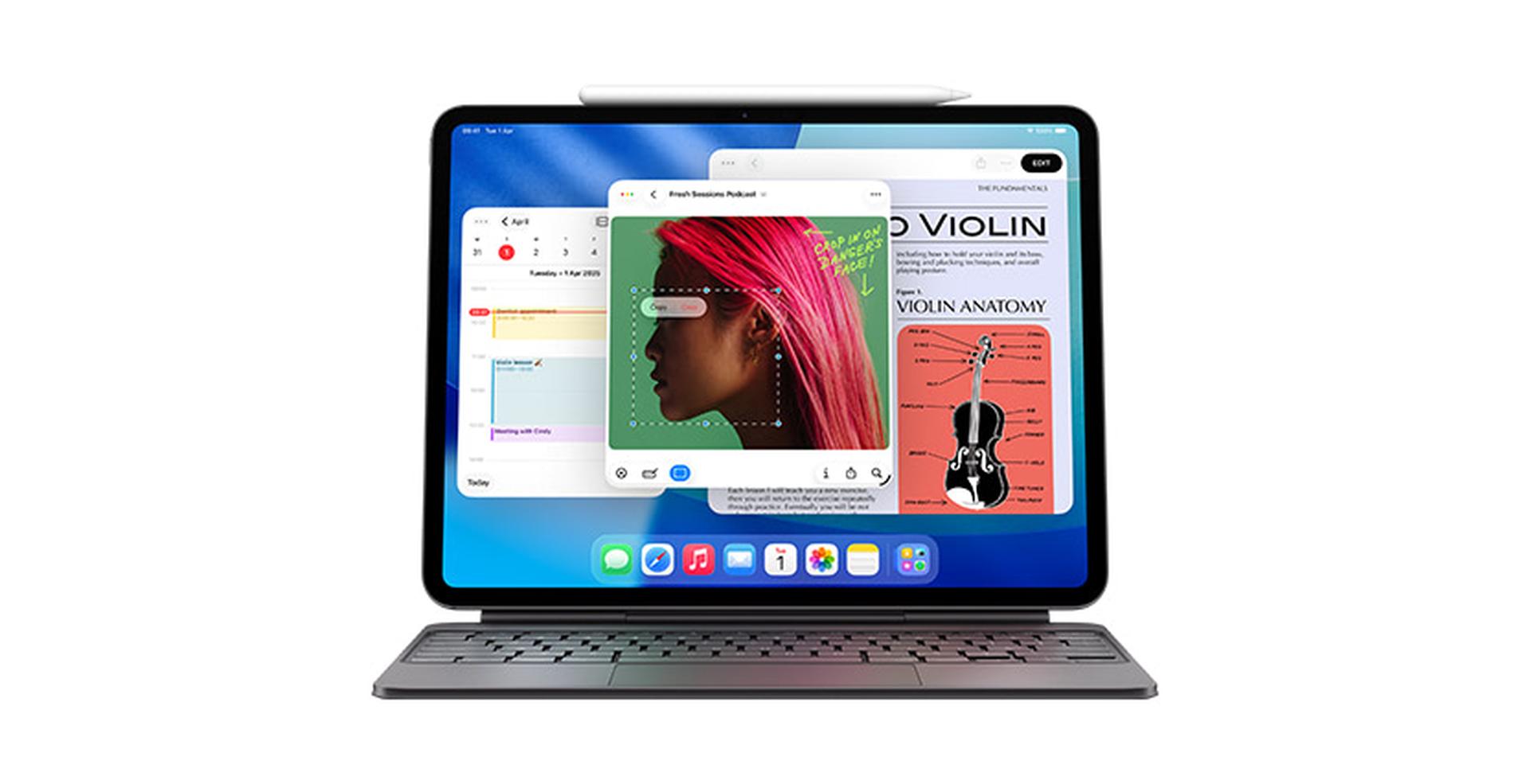 Tablet with keyboard showing multiple open apps, including music, calendar, and a violin book, with a stylus on top.