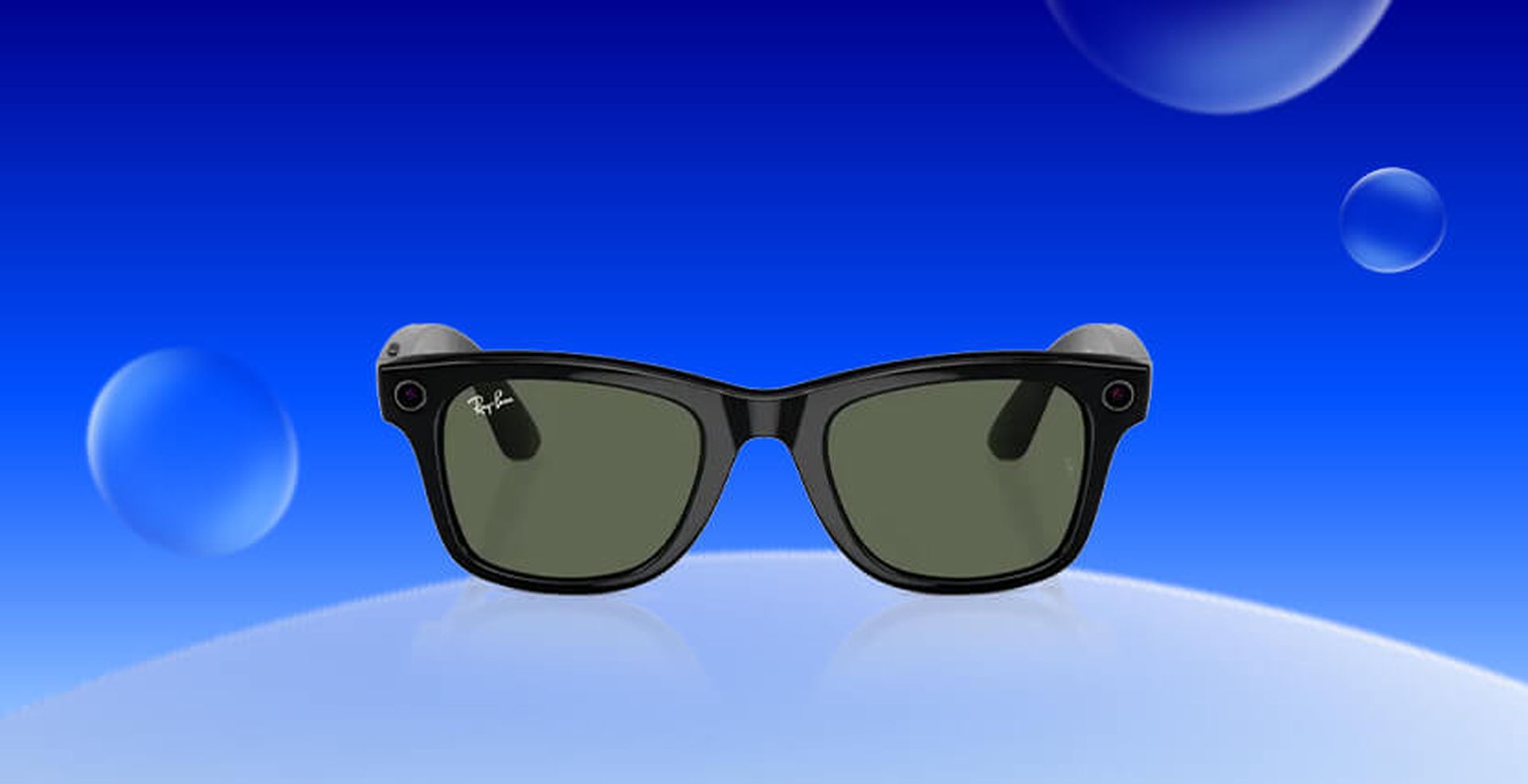 Black smart sunglasses with dark lenses on a blue gradient background with floating spheres.