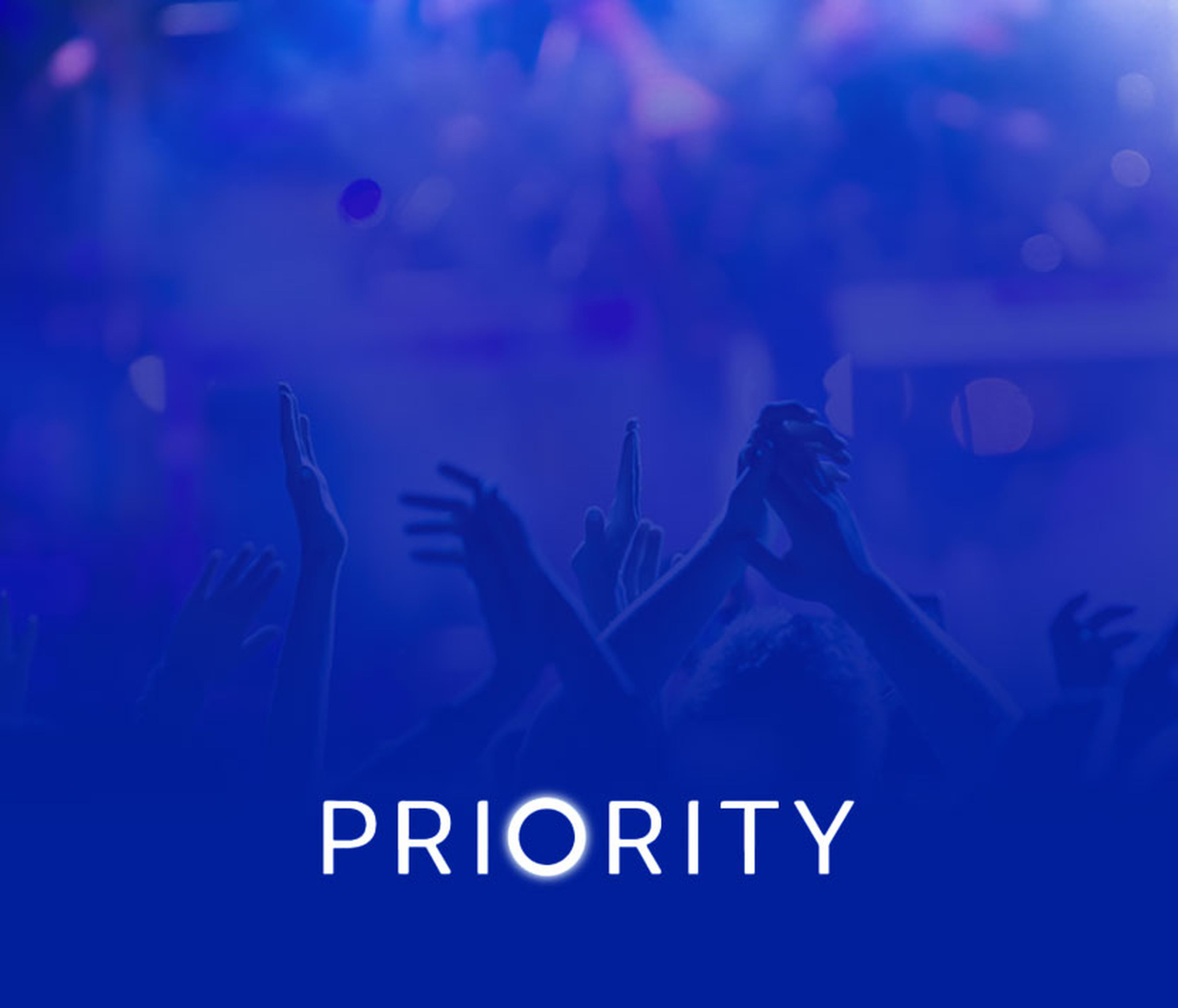 People with their hands up at Priority venue