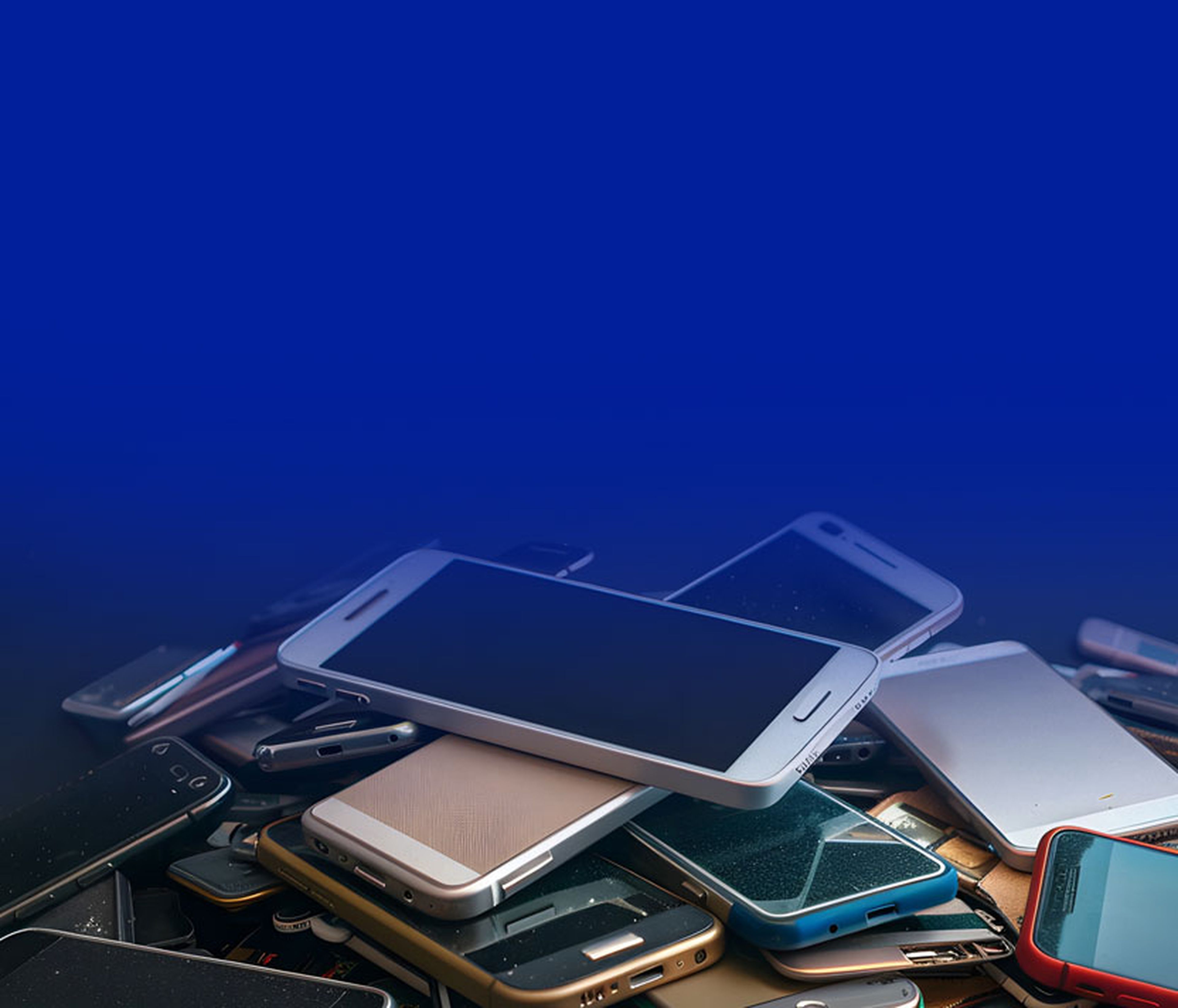 Selection of old smartphones on a pile